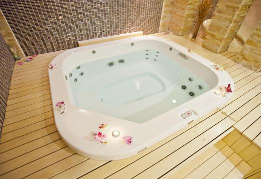 A water-filled hot tub, also known as a Jacuzzi®.