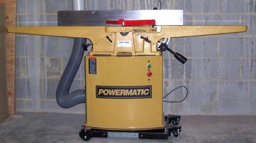 A jointer, which is used to make one side of a rough lumber board flat.