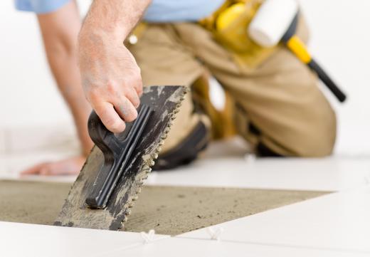 Tiling trowels are typically flat or spade shaped, and some have serrated, or notched, edges along two sides.