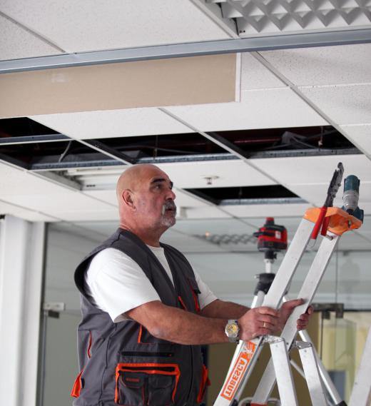 Drop or suspended ceilings require an interlocking grid system suspended by wires from the ceiling.