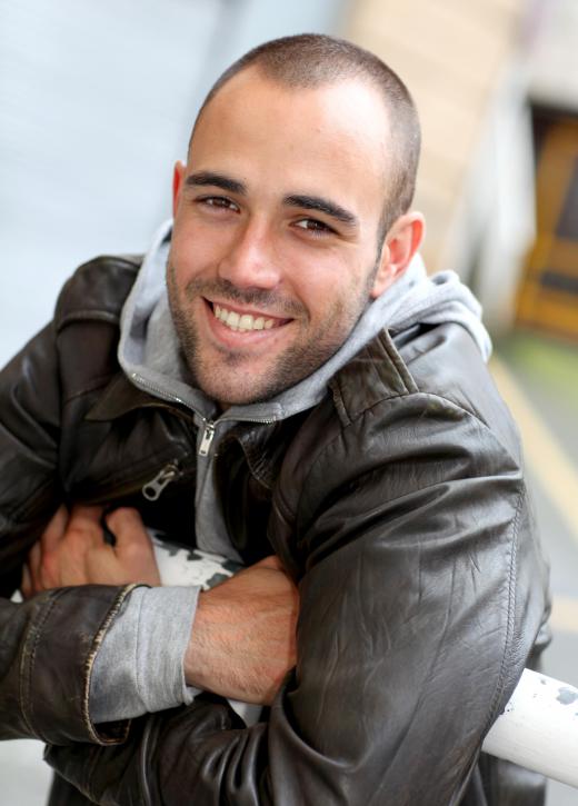 Man wearing a distressed leather jacket.