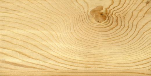 A veneer is a thin layer of wood applied on top of a lesser quality material.