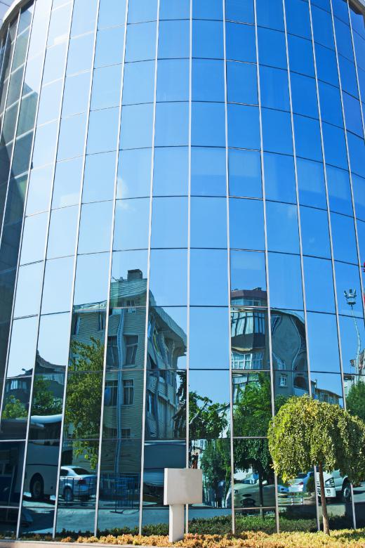 Building with reflective glass, which is glass that has been designed to reflect heat.