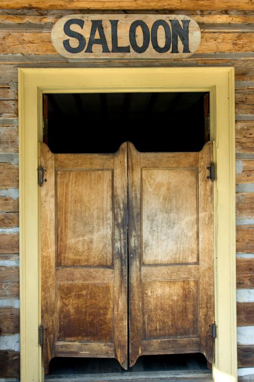 Saloon doors don't cover the entire opening to a room or structure.