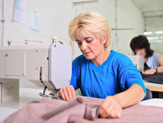 A seamstress making a French seam.