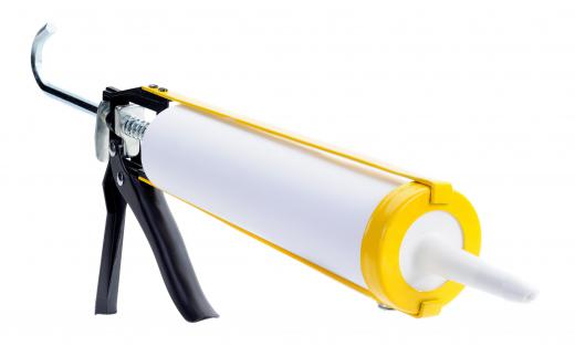 Silicone sealant in a caulk gun, which can be used to repair PVC pipes.