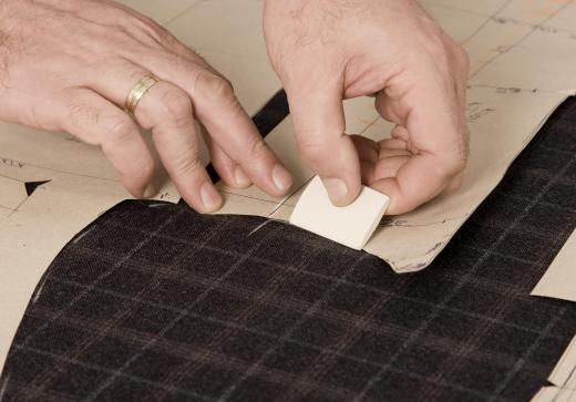 Tailors use chalk to temporarily mark fabric for cutting or altering.