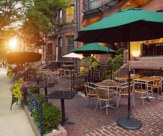 A sidewalk cafe may feature umbrellas to protect customers from the sun.