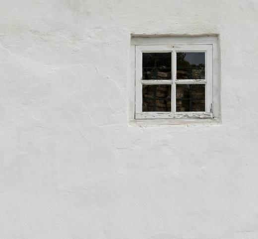 A sledge hammer may be used to remove stucco from a wall.