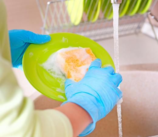 A woman washing dishes.