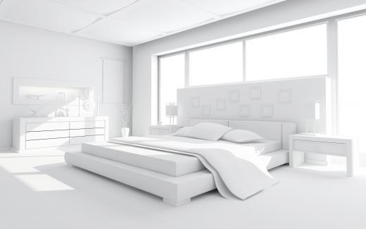 White bedroom with an eastern king (standard king) size bed.