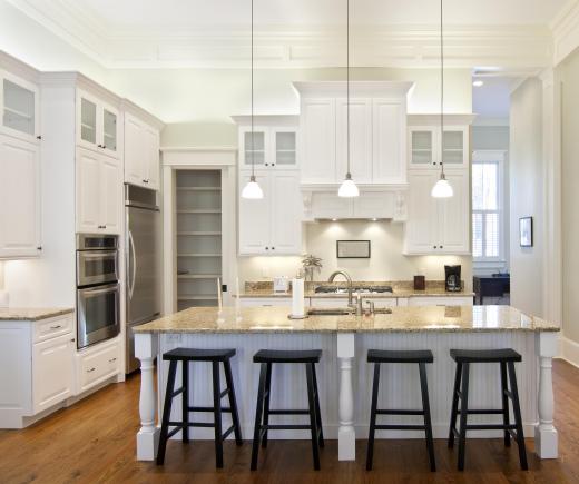 Kitchen storage cabinets are useful for holding silverware and small kitchen supplies.