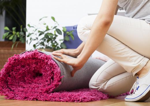 Area rugs can add colorful accents to a gray living room.