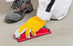 Sanding can help remove blemishes before floors are painted.